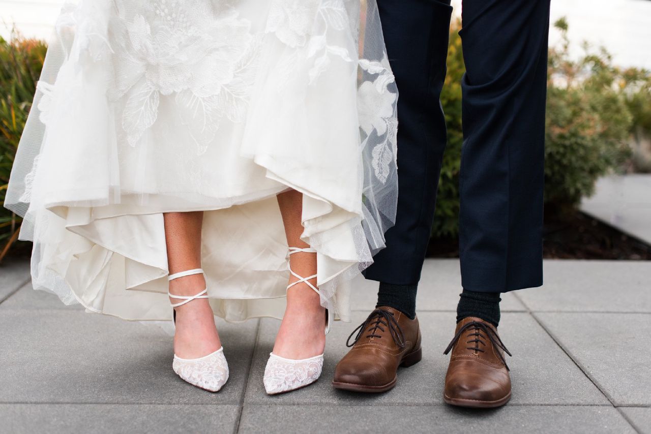 A detail photo of a bride and grooms shoes