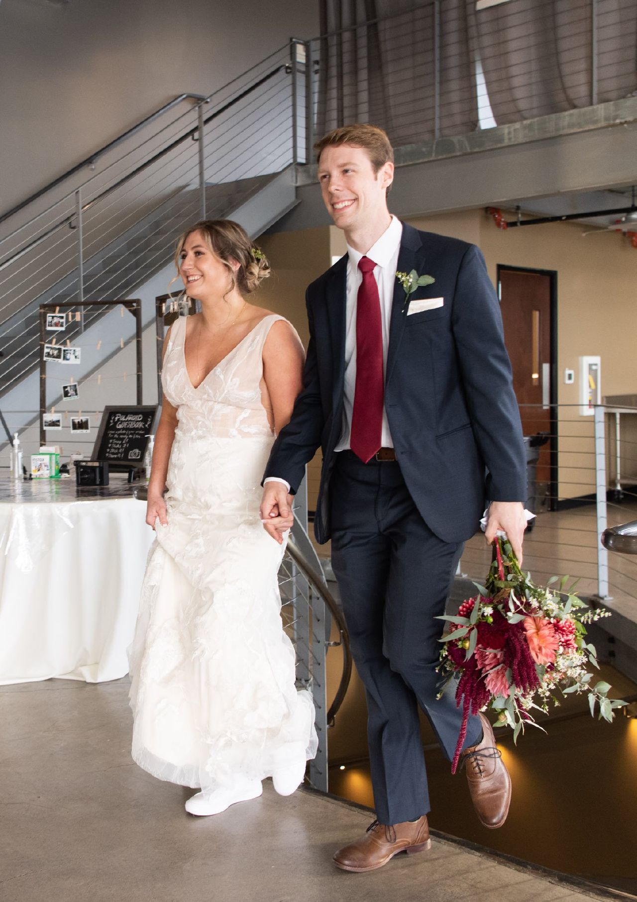 A bride and groom entering their wedding reception