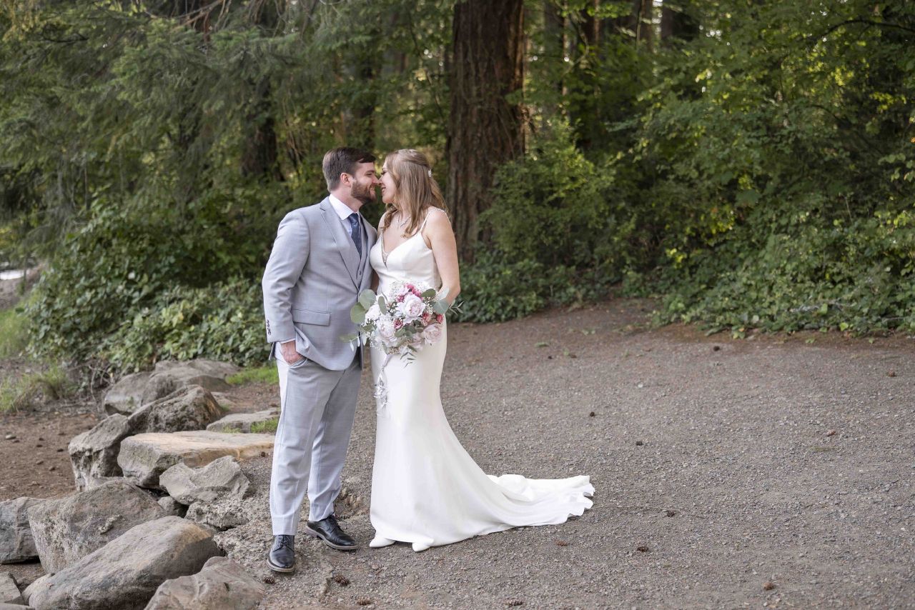 Couple share a quiet moment during outdoor Camas Washington wedding.